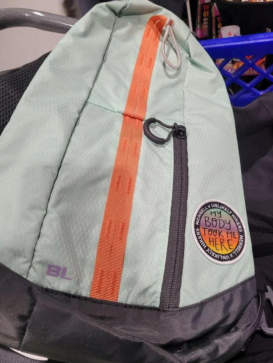 Merrell X Unlikely Hikers 8L Mint Green Sling Backpack with Orange Accent - Picture 2 of 2